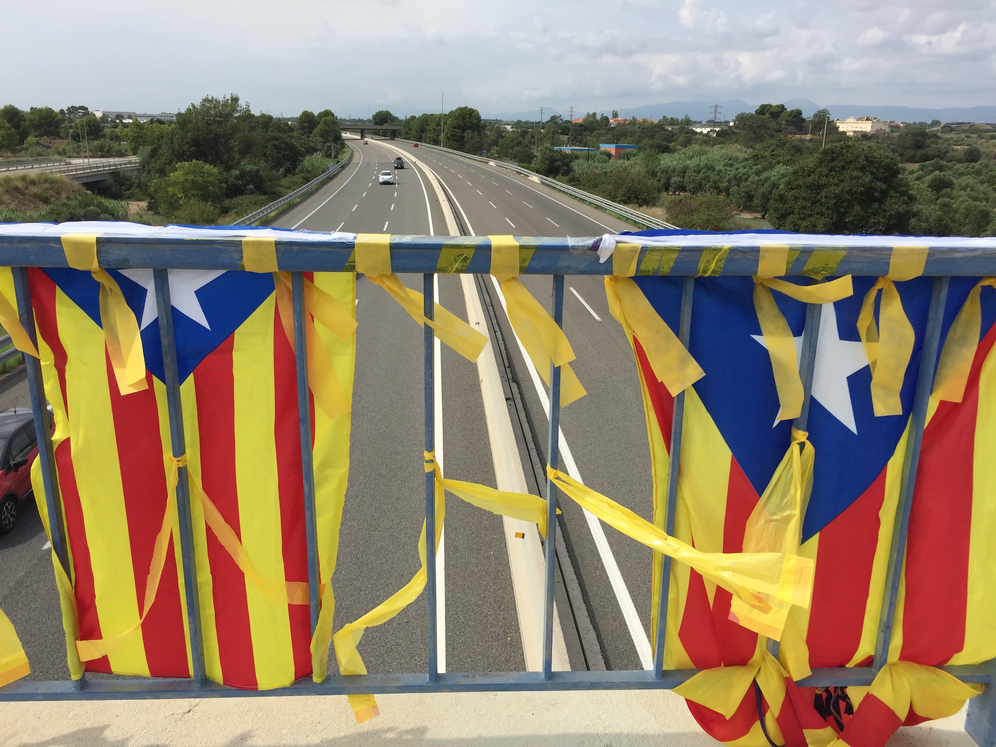 Pro independence flags on brodge over AP7 road